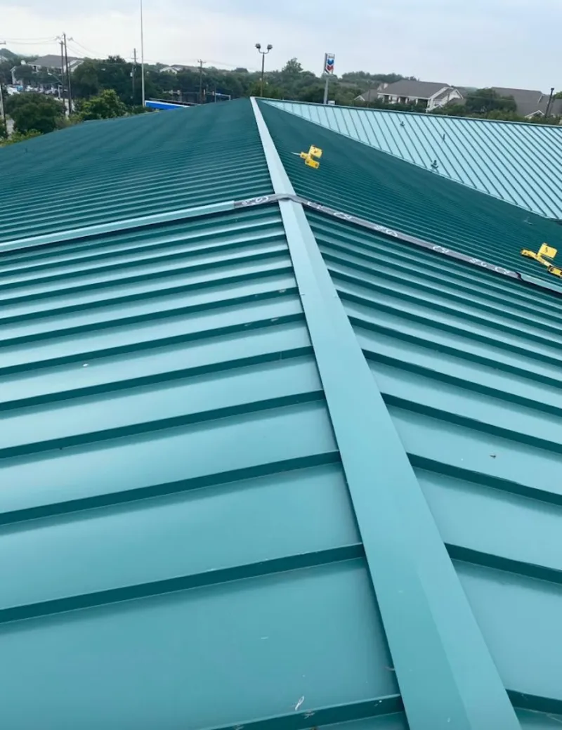 Green commercial metal roof ridge and valley for Metal Roof Repair in Woodbury